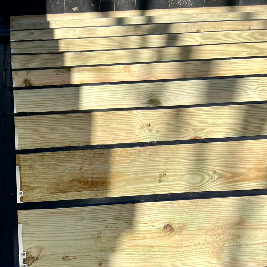 Imus Seal Butyl Joist Tape Non-Skid on sunny and shaded deck structure